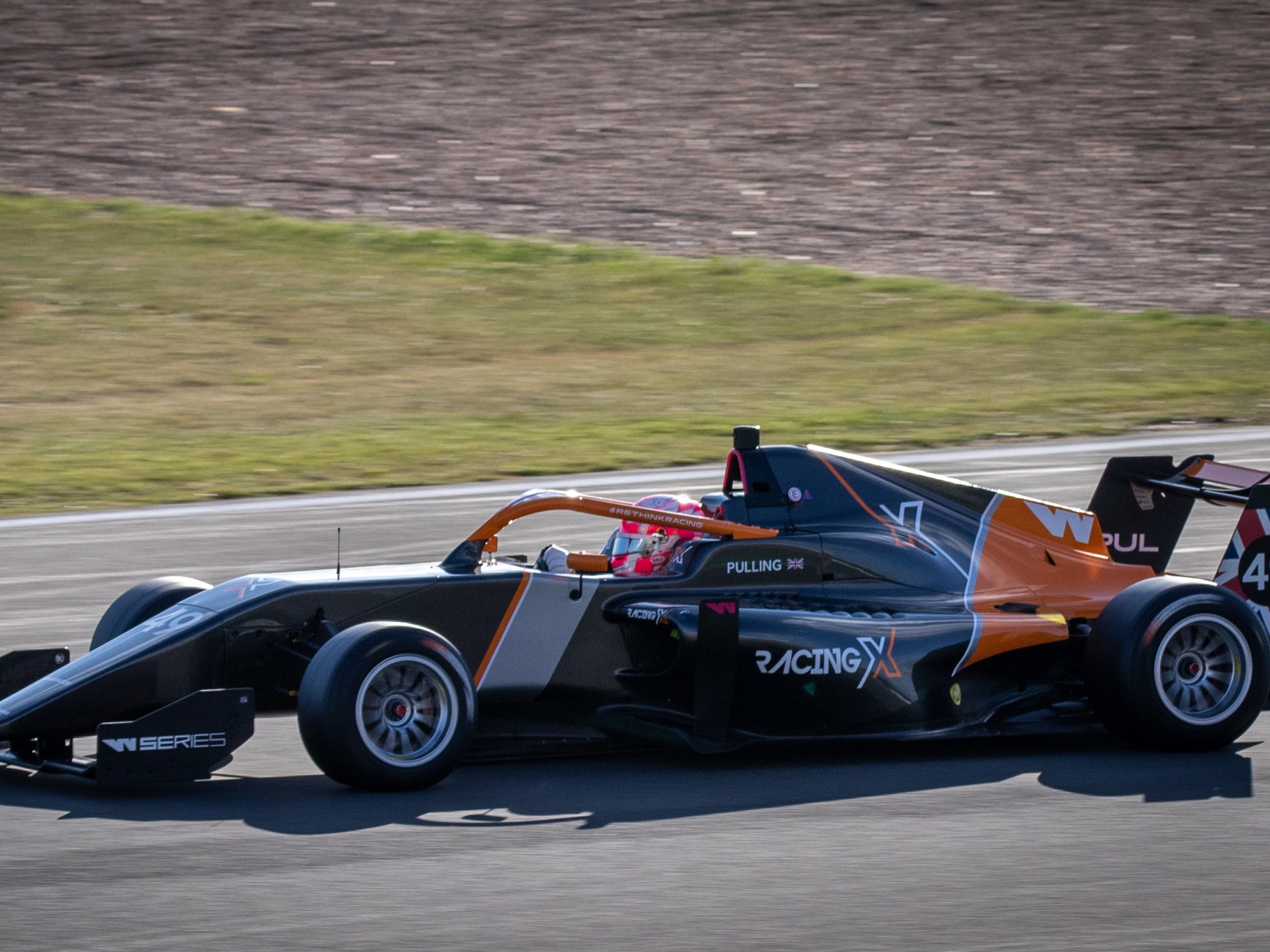 Abbi Pulling racing at the 2022 W Series Silverstone round; documentary action photograph cropped for the Journal layout.