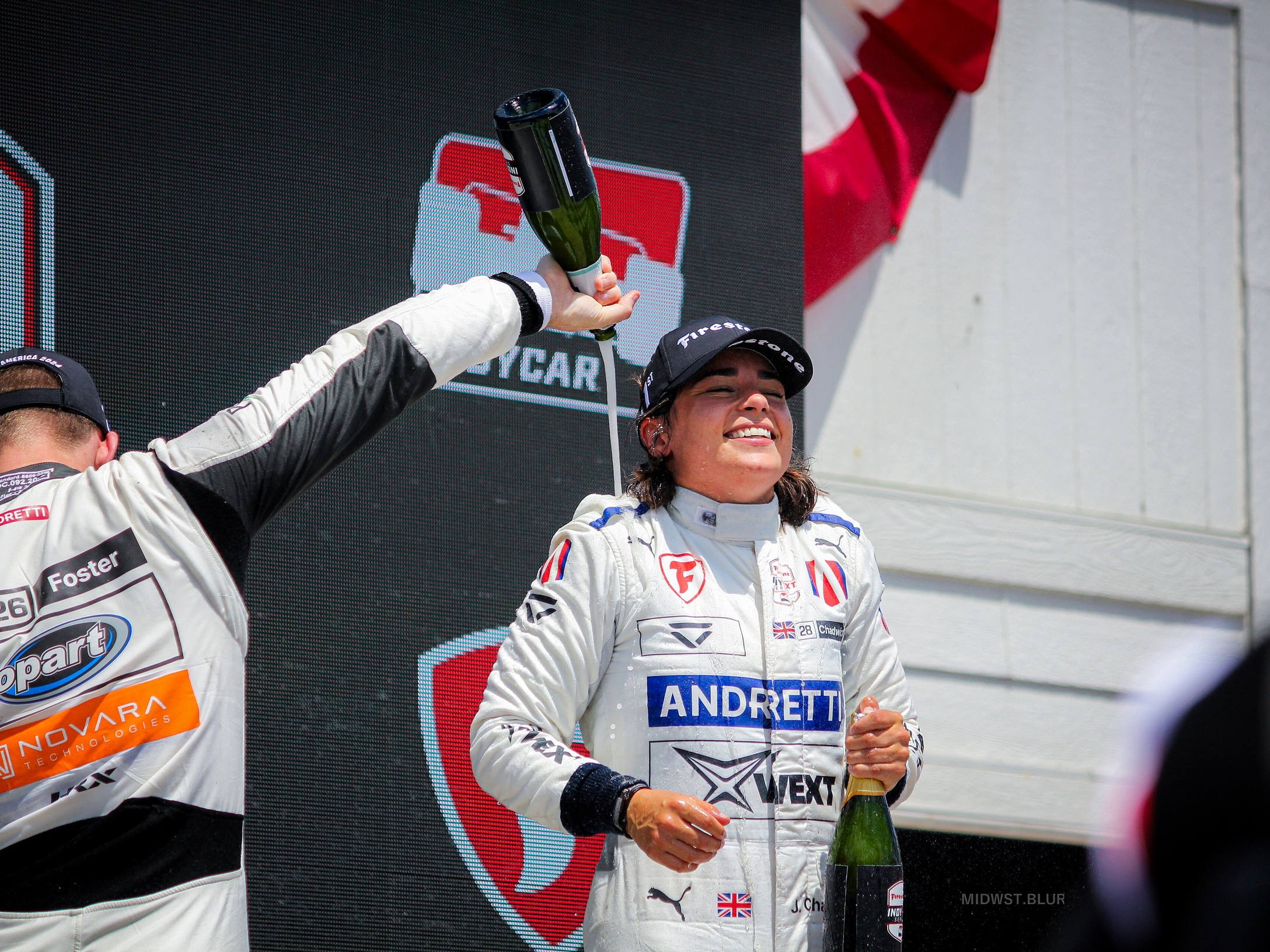 Jamie Chadwick at the 2024 XPEL Grand Prix at Road America in a podium-context moment; career-context photograph, not Le Mans, Genesis, Hypercar, 2026, or Test Day imagery.
